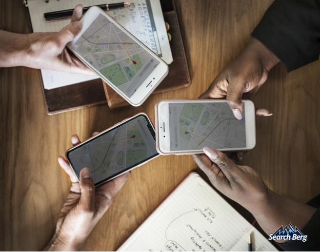 three mobile phones displaying Google Maps